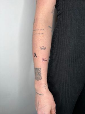 Get a small lettering tattoo by the talented artist Emma InkBaby, perfect for subtle yet meaningful body art.