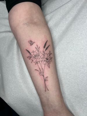 Beautiful and delicate flower tattoo designed by Emma InkBaby with intricate fine line details.