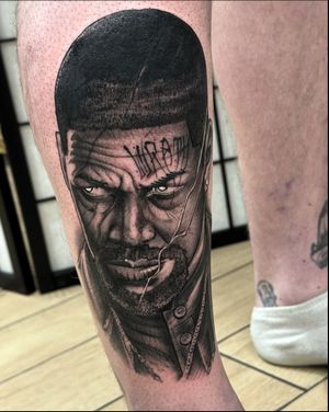Get inked with an illustrative black & gray tattoo inspired by Denzel Washington's iconic role in Training Day. Let this piece take you on a journey through the gritty underworld of Los Angeles. Expertly crafted by tattoo artist Sam Waiting.