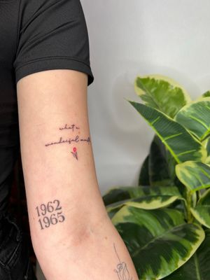 Elegant small lettering tattoo by Emma InkBaby, perfect for minimalist lovers seeking a subtle yet meaningful design.