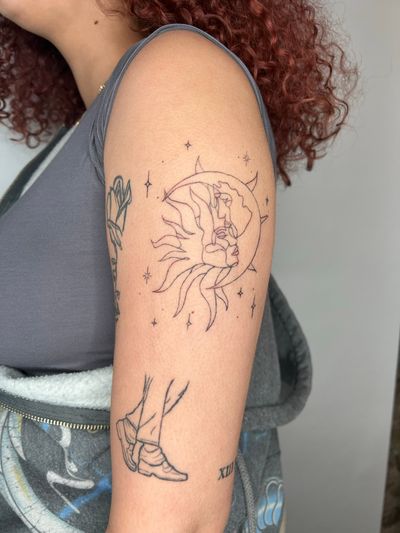 Experience the beauty of the sun and moon in this fine line illustrative tattoo by Emma InkBaby.