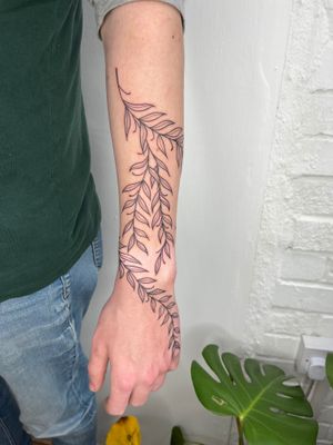 Transform your body into a botanical masterpiece with this stunning vine and plant illustrative tattoo by the talented artist Michelle Harrison.