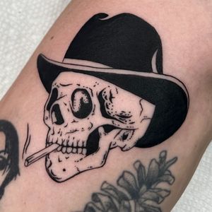 Bold blackwork style by Andrew Garinther, featuring a skull wearing a cowboy hat in illustrative design.