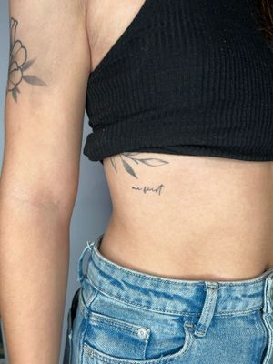 Unique and delicate small lettering design by Emma InkBaby, perfect for minimalistic tattoo lovers.