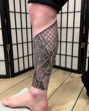 Get inked with this stunning blackwork koi fish tattoo with intricate patterns by the talented artist Sam Waiting. Perfect for lovers of bold and detailed designs.