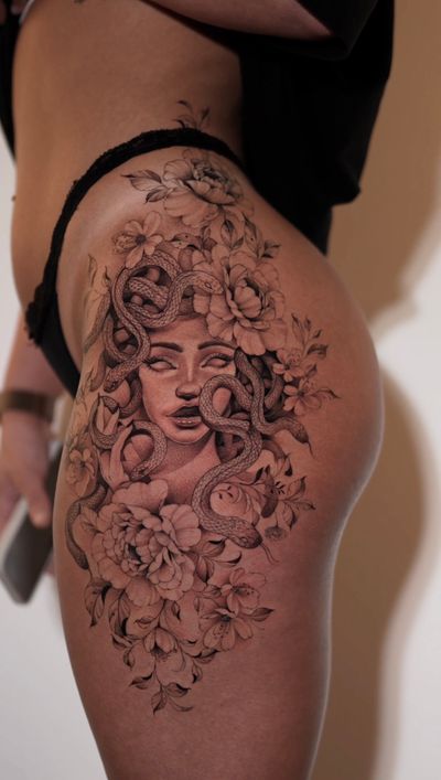 A stunning black and gray fine line tattoo of a floral Medusa design by the talented artist Ion Caraman.