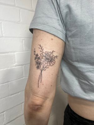 Beautiful hand-poked dotwork and fine line tattoo by Marketa.handpoke featuring a stunning bouquet of flowers.