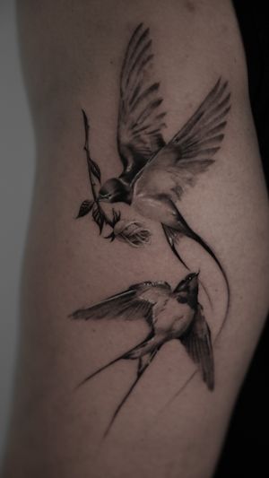 Intricate black and gray tattoo by Viola featuring a stunning micro realistic swallow and rose design.