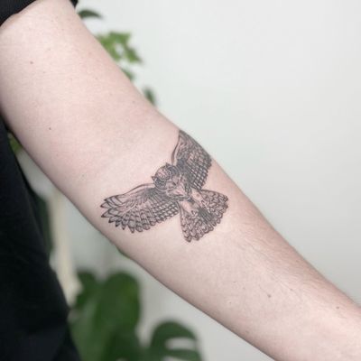 Micro realistic Eagle Owl tattoo on forearm 