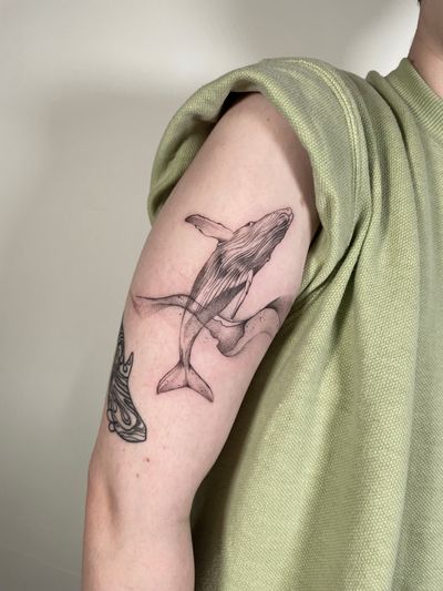 Explore the depths of creativity with this black and gray dotwork whale tattoo, expertly crafted by the talented artist Sam.