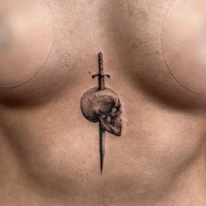 Get inked with Viola's impeccable black and gray micro realism design featuring a skull and sword. Perfect blend of darkness and detail.