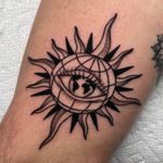 Traditional globe tattoo