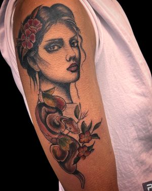Experience the captivating fusion of snake and lady in this neo traditional illustrative tattoo by Nat.