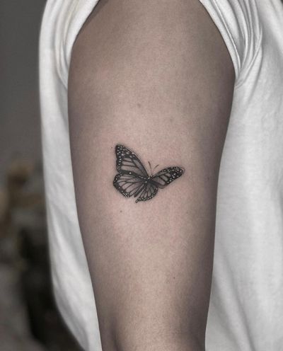 Experience the beauty of micro realism with this stunning black and gray butterfly tattoo by the talented artist Ry Roger.