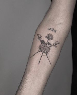 A stunning black and gray micro-realism tattoo featuring a rose, sword, and crown, created by the talented artist Ry Roger.