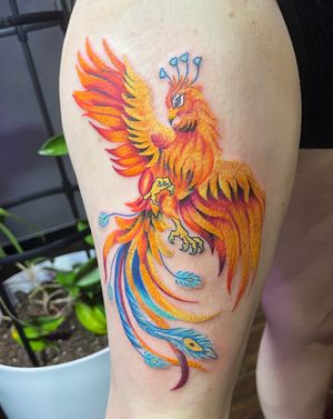 Colorful phoenix on thigh
