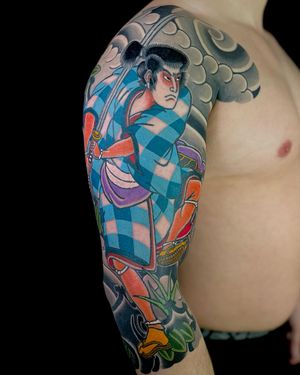 Experience the power and grace of the samurai tradition with this stunning Japanese tattoo design by renowned artist Martin Kirke.