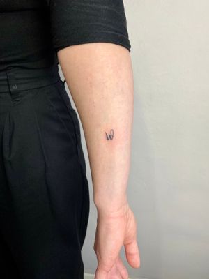 Get a tiny, customized tattoo with small hand-poke lettering by Charlotte Pokes for a subtle and unique addition to your body art.