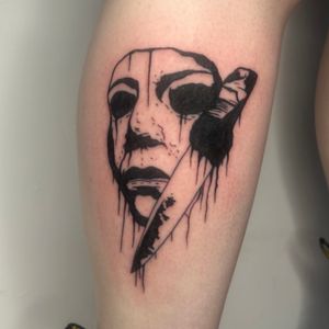 A stunning illustrative tattoo featuring a dramatic knife and theatrical mask by the talented artist Zanzi La Vey.