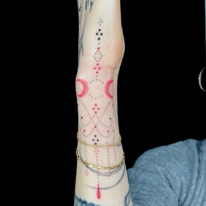 Elegant hand-poked design by Indigo Forever Tattoos, showcasing detailed dotwork ornamentation.