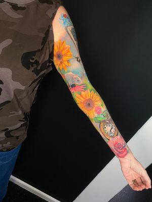 Marvel at Marie Terry's stunning realism tattoo featuring a vivid sunflower entwined with a detailed clock motif.