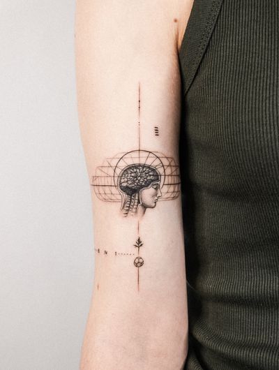 Experience the fusion of fine line, geometric design, and micro-realism in this stunning brain tattoo, expertly crafted by Gabriele Edu.