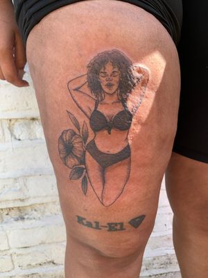 Beautifully detailed flower tattoo on dark-skinned woman in bikini by talented artist jadeshaw_tattoos.