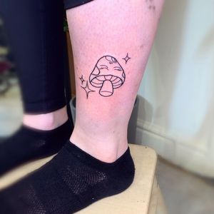 Unique illustrative tattoo featuring a star and mushroom design by jadeshaw_tattoos. Perfect for nature lovers and dreamers.