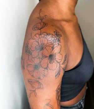 Beautiful illustrative flower design on dark skin by jadeshaw_tattoos, perfect for a delicate and elegant look.