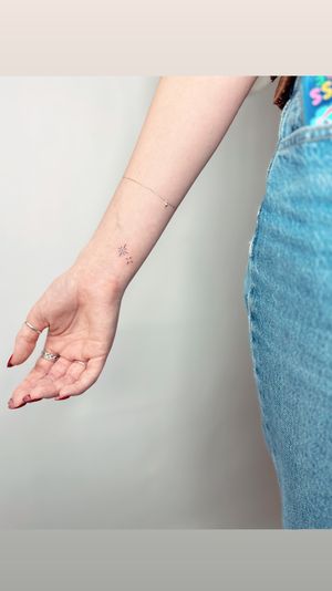 Get inked with a dainty star design by the talented jadeshaw_tattoos for a minimalistic and elegant look.