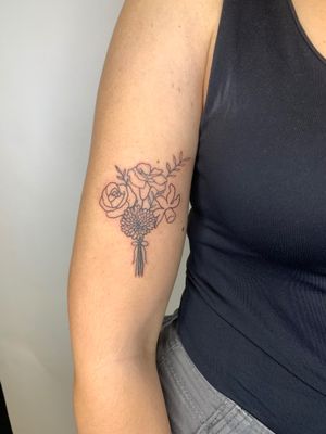 Beautiful bundle of flowers done in illustrative style by jadeshaw_tattoos. A unique and intricate design that will stand out.