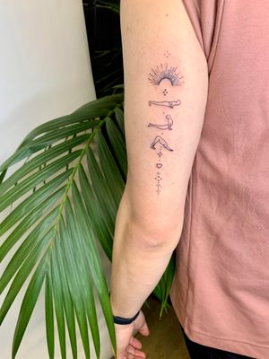 Experience inner peace with this illustrative tattoo by jadeshaw_tattoos, featuring a beautiful sun and yoga motif.