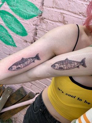 Unique illustrative tattoo combining fish, jigsaw, and puzzle elements. By talented artist jadeshaw_tattoos.