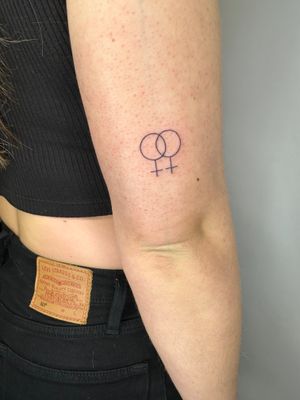 Show your support for LGBTQIA+ with this delicate tattoo by jadeshaw_tattoos. Explore the beauty of diversity with fine line art.