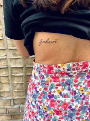 A delicate and intricate fine line tattoo of small lettering by jadeshaw_tattoos, conveying a message with grace and elegance.