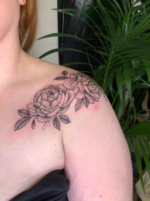 Admire the delicate beauty of a peony flower in this stunning floral and illustrative tattoo by jadeshaw_tattoos.