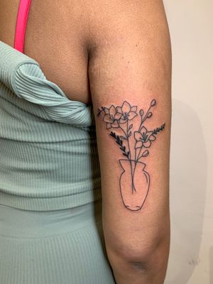 Check out this stunning tattoo by jadeshaw_tattoos featuring a beautiful flower, vase, and bundle design. Perfect for those who love illustrative tattoos!