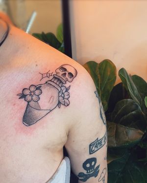 Unique dotwork tattoo design combining elements of flower, skull, poison bottle and potion, meticulously crafted by artist jadeshaw_tattoos