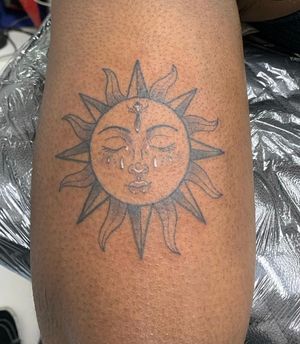 Radiant sun design expertly done by jadeshaw_tattoos, perfect for darker skin tones. Stand out with this unique and vibrant piece!