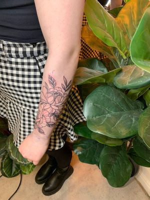 Get a stunning floral tattoo by jadeshaw_tattoos, featuring a delicate fine line illustration of a beautiful flower.