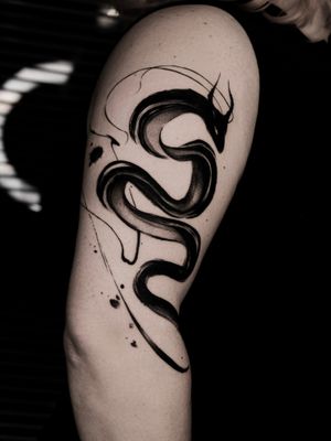 Black work dragon abstract tattoo
