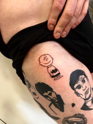Get nostalgic with this illustrative tattoo of Charlie Brown from Peanuts, expertly designed by Miss Vampira.