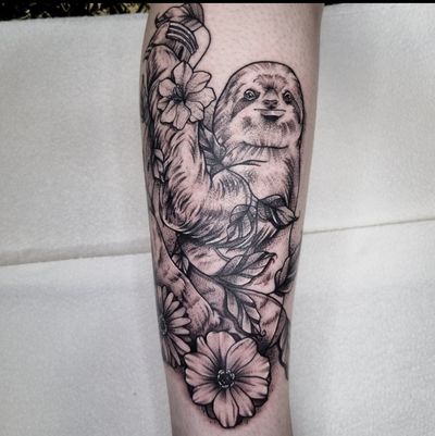 Unique tattoo combining a sloth and a flower in black and gray dotwork, expertly done by Belle Tannahill.
