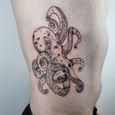Belle Tannahill's illustrative style brings this octopus tattoo to life with detailed dotwork, creating a mesmerizing design.