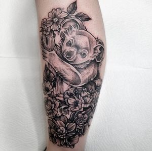 Unique dotwork style tattoo featuring a delicate flower and adorable koala bear, designed by talented artist Belle Tannahill.