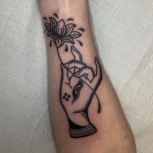Unique ornamental and illustrative tattoo design featuring an eye and hand mudra by the talented artist Claudia Vicente.