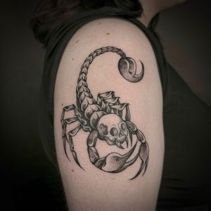 Get a unique black and gray tattoo featuring a skull and scorpion by the talented artist Jenny Dubet.