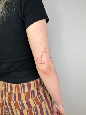 Discover the beauty of your horoscope with this delicate fine line tattoo featuring the Scorpius constellation by Emma InkBaby.