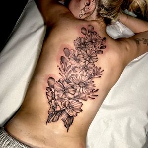 Get a stunning floral tattoo by Cristina featuring intricate botanical details. Perfect for nature lovers and art enthusiasts alike.