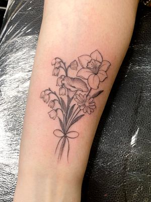 Capture the beauty of nature with this vibrant illustrative flower bouquet tattoo by talented artist Edyta. Perfect for anyone who loves floral designs.